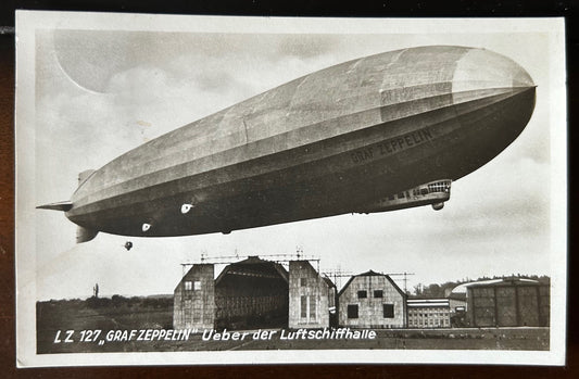 Graf Zeppelin airship flying over its hangar photo postcard