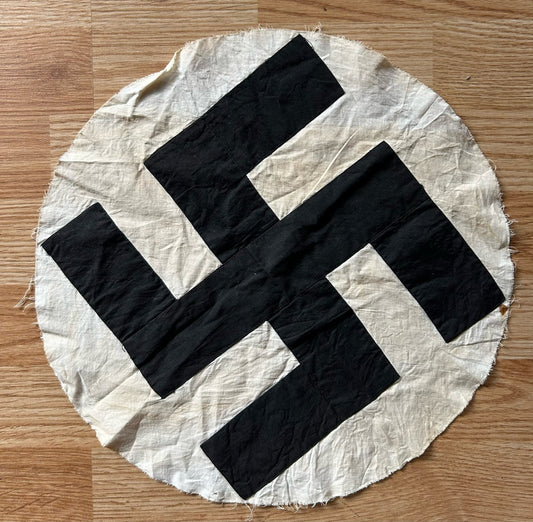 Cloth disk swastika - removed from flag